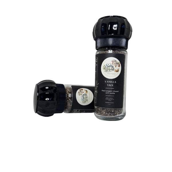 Two pepper mills with vanilla and black pepper labels on a white background
