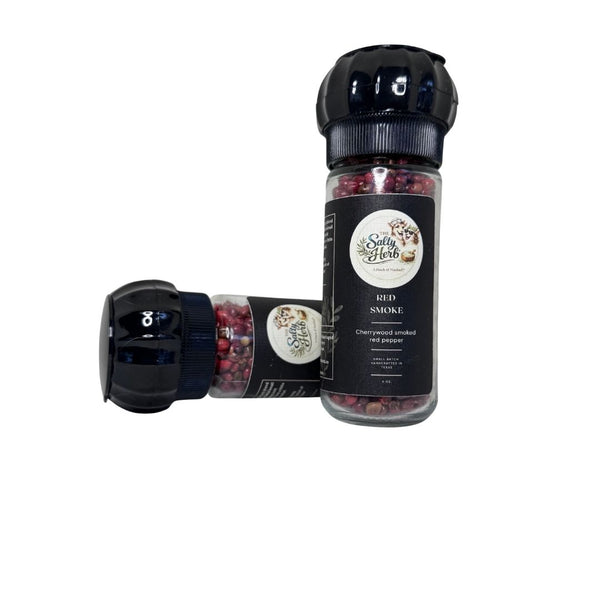 Spice jar labeled 'Red Smoke' with a black lid on a white background